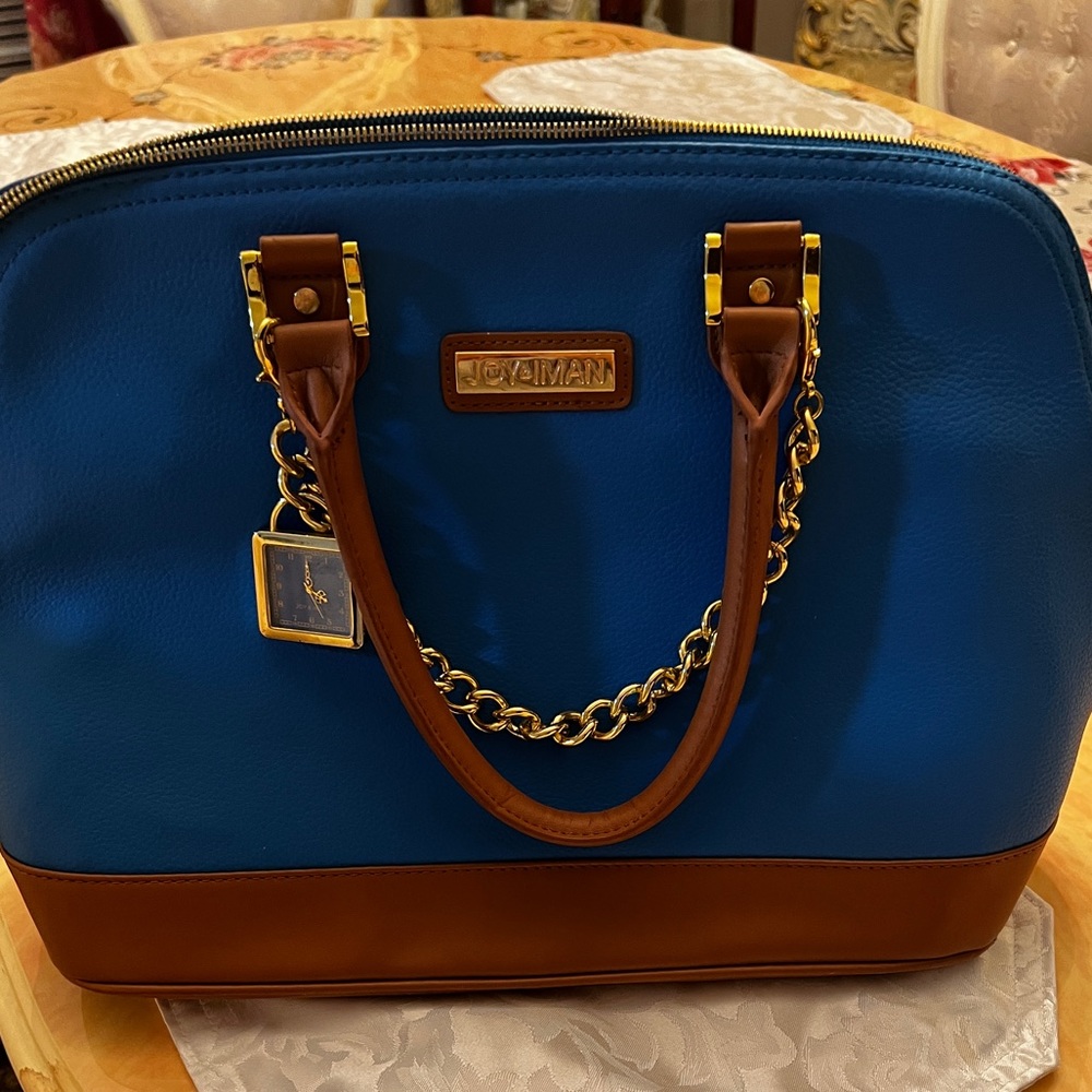 Joy Iman Handbag unique multi colored several satin lining deep pockets.